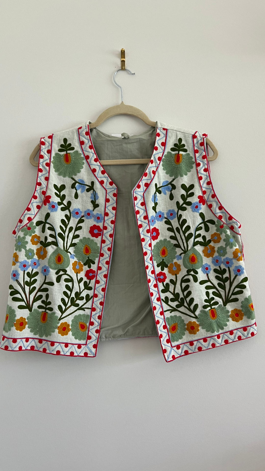 Vest with happy embroidery pattern