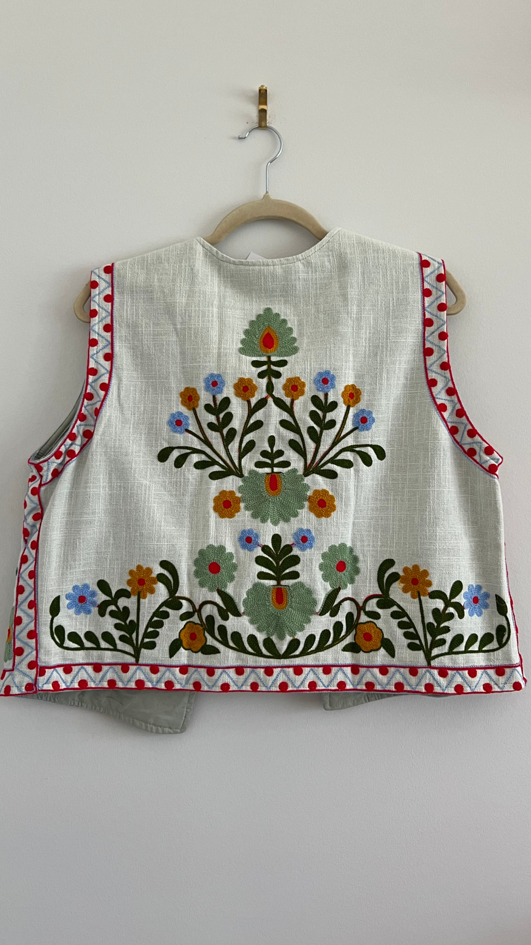 Vest with happy embroidery pattern