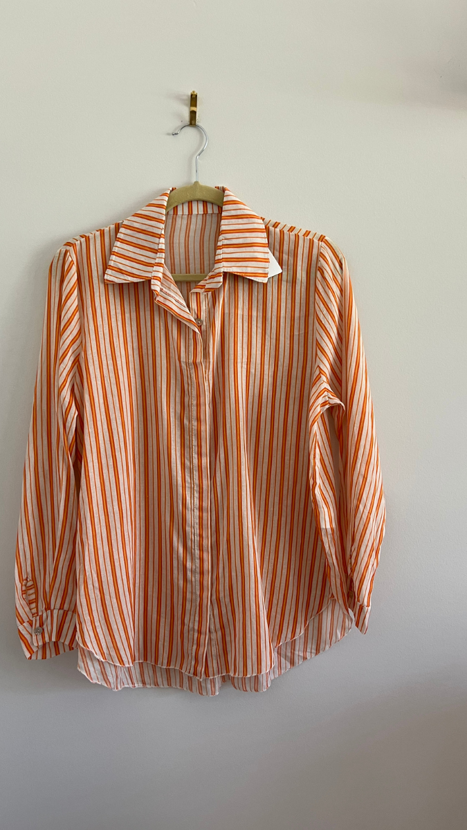 White blouse with orange stripes